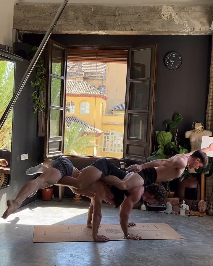 Three guys, four hands, one yoga mat, and somehow… balance achieved 🧘🏻‍♂️✨